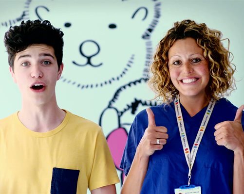 The film narrator standing next to an anaesthetist