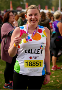 Lady with medal from Royal Parks Half Marathon