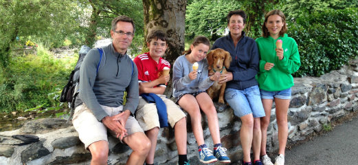 A photo showing the whole Hannah family including their dog. Alice is on the far right.